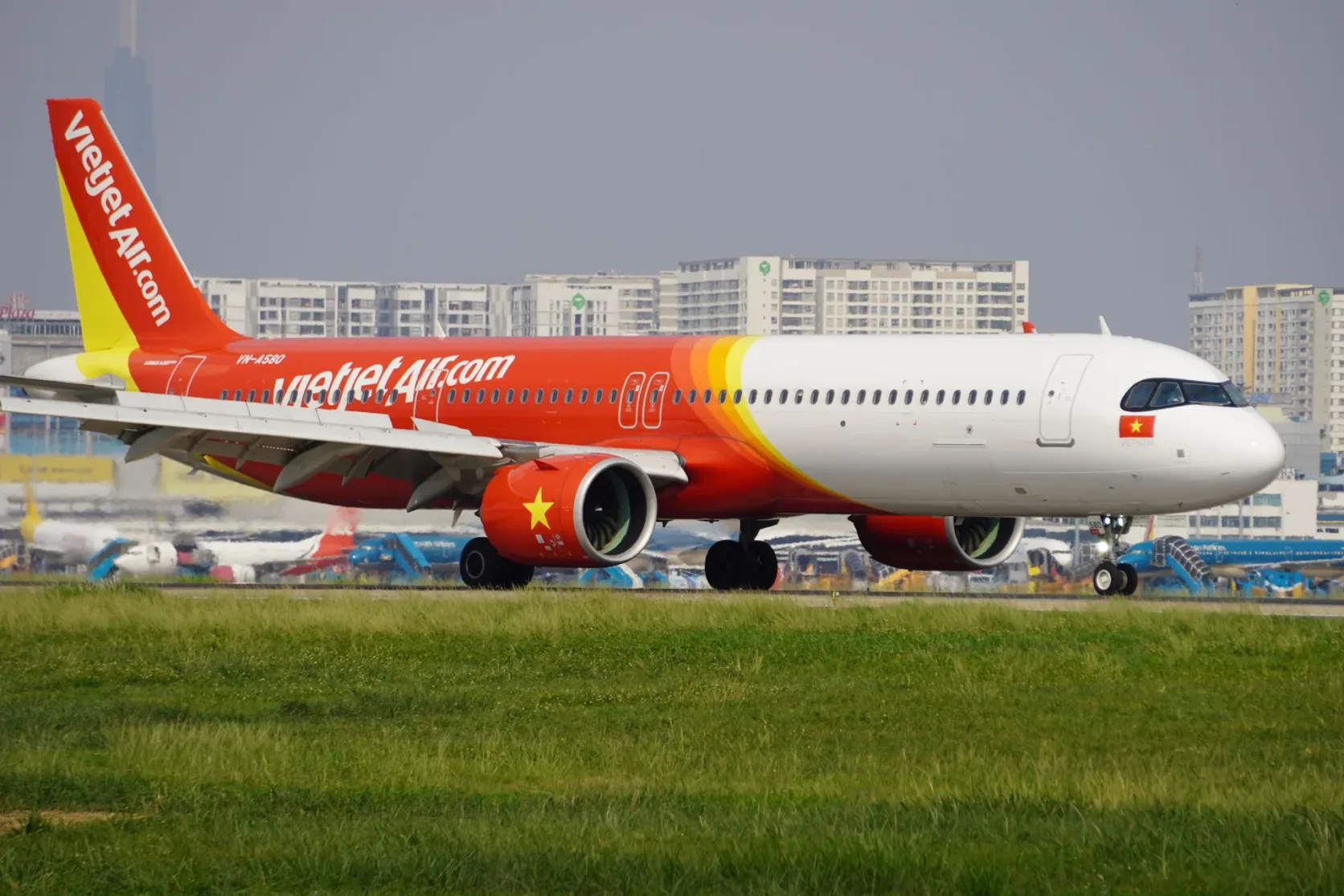 A Vietjet aircraft moving on an airport taxiway.