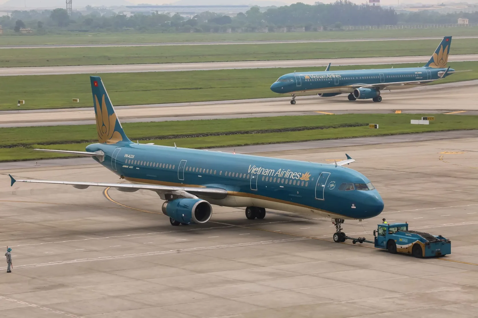 Des avions de Vietnam Airlines sur le tarmac de l’aéroport de Noi Bai, à Hanoï.
